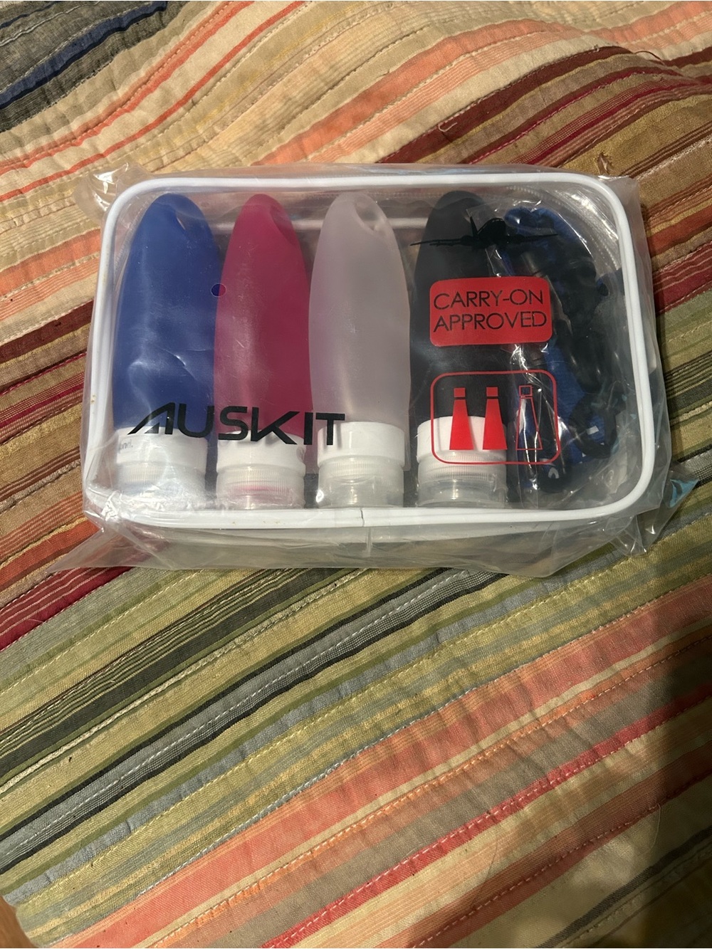 MUSKIT Travel Silicone Bottles Set - Blue, Pink, Clear, Black